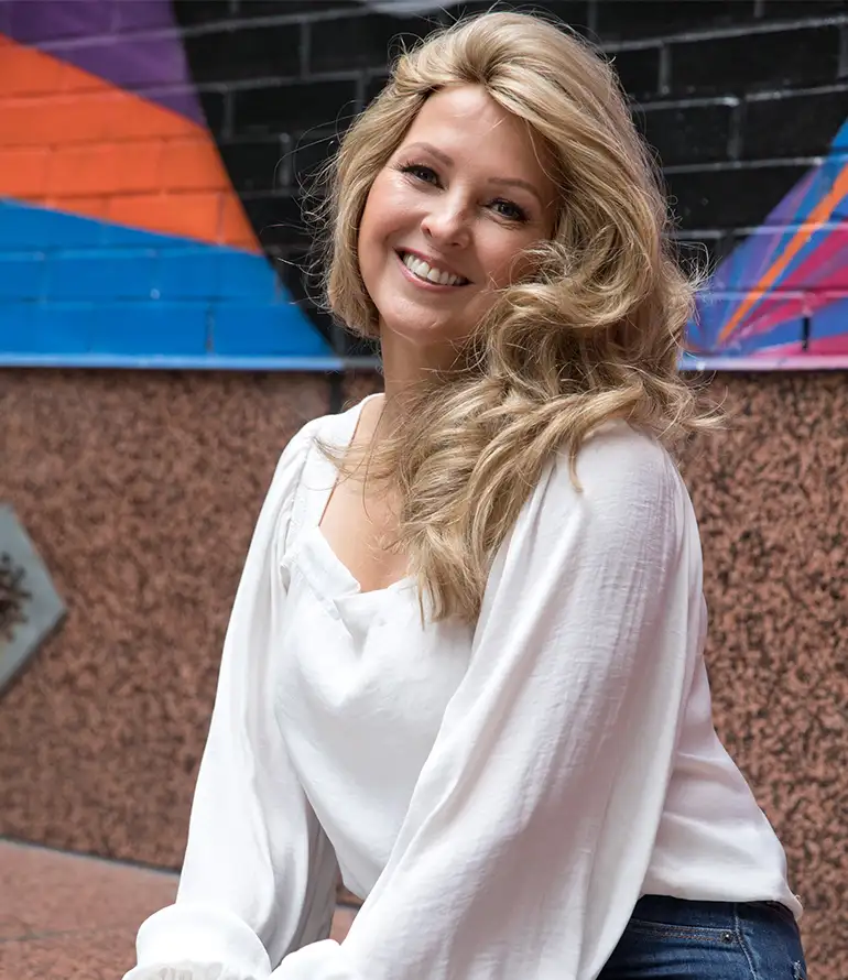 woman wearing blond contressa wig